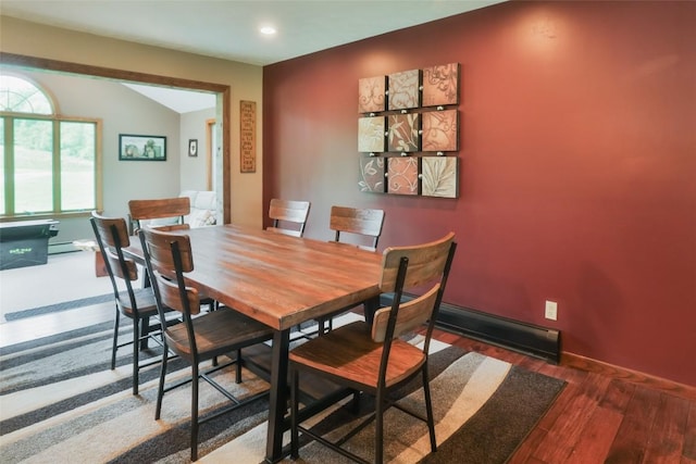 dining room with dark hardwood / wood-style flooring