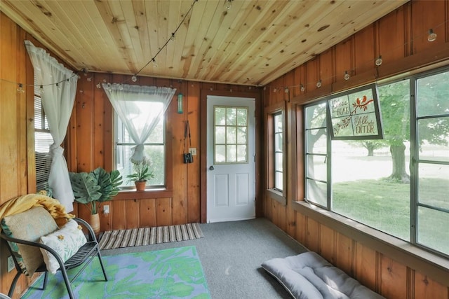 unfurnished sunroom with wooden ceiling