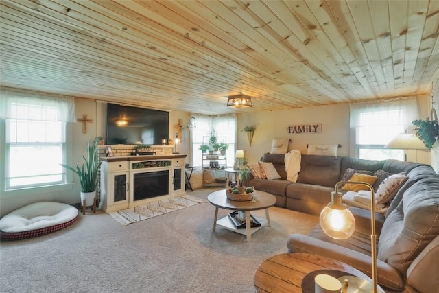 carpeted living room featuring plenty of natural light and wooden ceiling