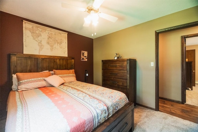 bedroom with light colored carpet and ceiling fan