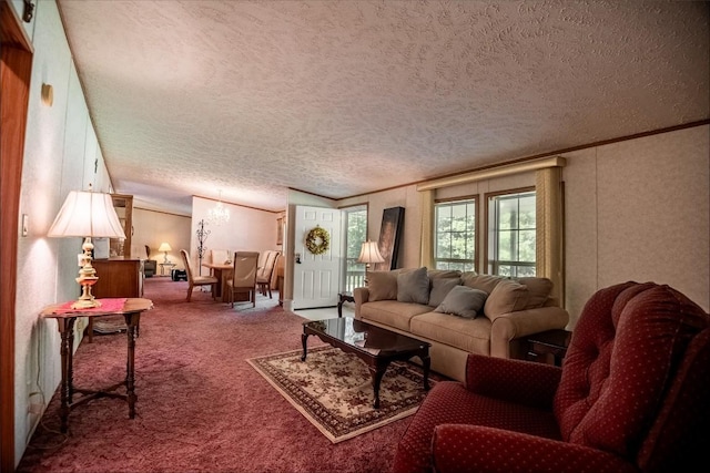 living room featuring carpet flooring, a textured ceiling, and ornamental molding