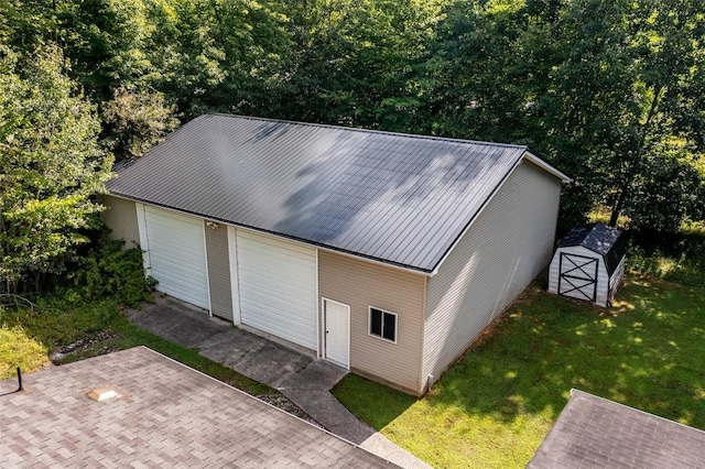 garage with a yard