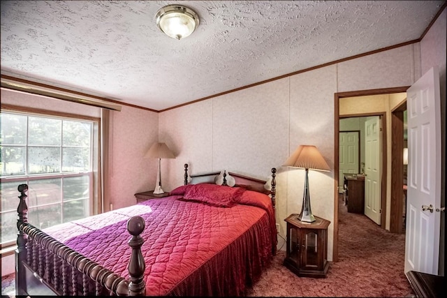 carpeted bedroom with a textured ceiling and crown molding