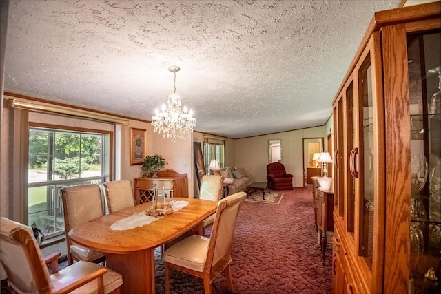 dining space with crown molding, carpet floors, a chandelier, and a textured ceiling