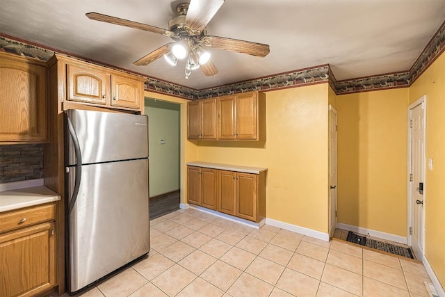4164 Emily Dr, North East, PA 16428 - kitchen featuring freestanding refrigerator, light tile patterned floors, a ceiling fan, and light countertops