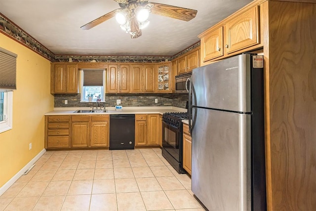 4164 Emily Dr, North East, PA 16428 - kitchen featuring black appliances, ceiling fan, decorative backsplash, light tile patterned floors, and glass insert cabinets