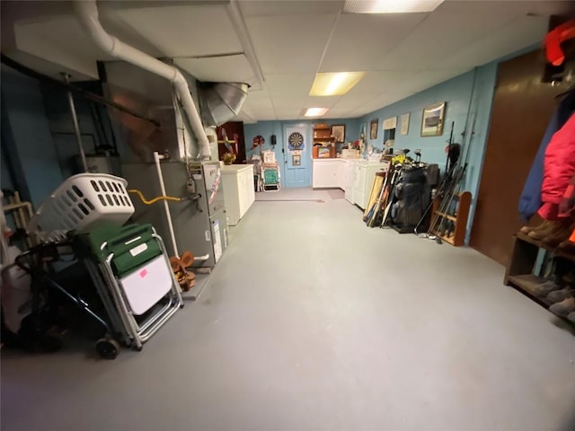 basement featuring washing machine and clothes dryer