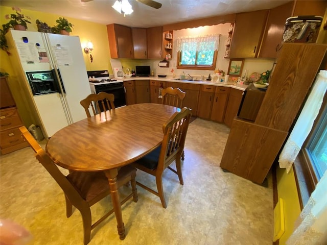 kitchen with ceiling fan and white appliances