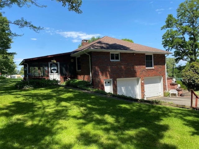 view of property exterior with a garage and a lawn