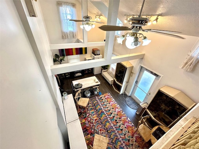 interior space featuring dark wood-type flooring and a textured ceiling