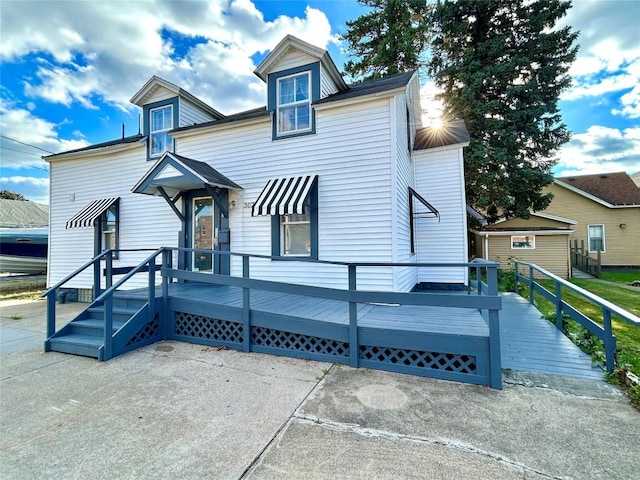 view of front of home with a wooden deck