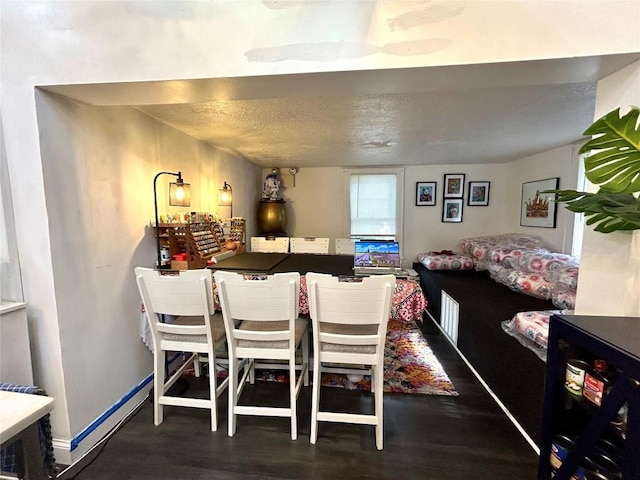 dining room featuring dark wood-type flooring