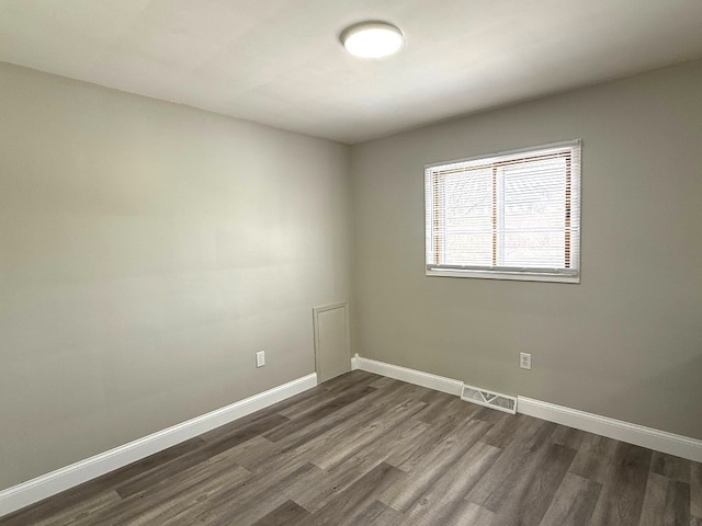 empty room featuring dark hardwood / wood-style floors