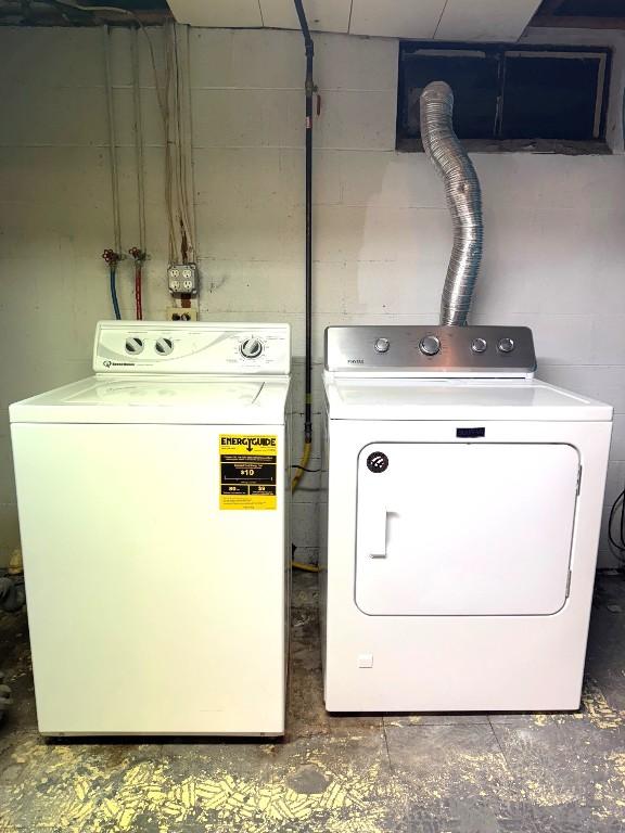 laundry room featuring washing machine and dryer