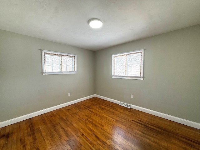 empty room with wood-type flooring