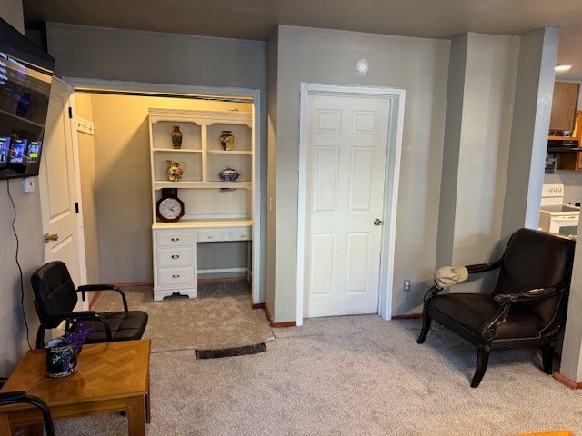 747 E 25th St, Erie, PA 16503 - sitting room featuring an office area, light colored carpet, and baseboards