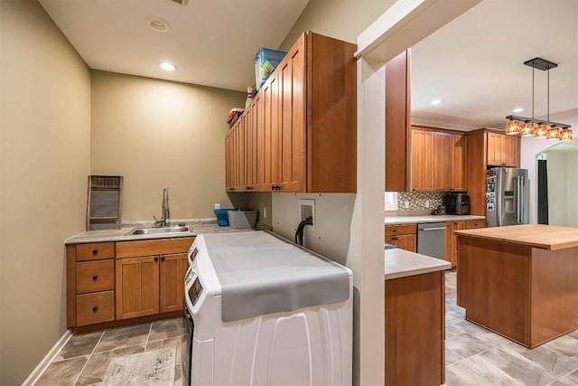21720 Matthew Ln, Saegertown, PA 16433 - laundry room featuring light stone finish flooring, recessed lighting, washer / dryer, and baseboards