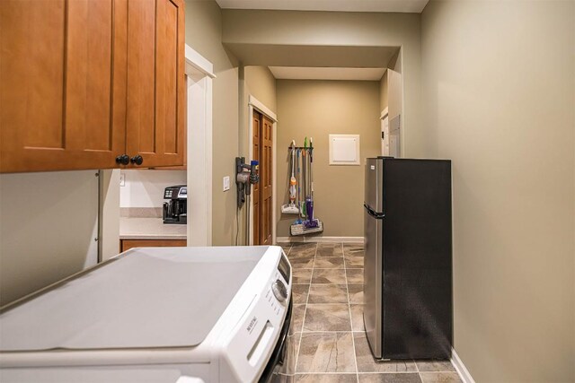 21720 Matthew Ln, Saegertown, PA 16433 - washroom featuring washer and clothes dryer, baseboards, cabinet space, and tile patterned floors
