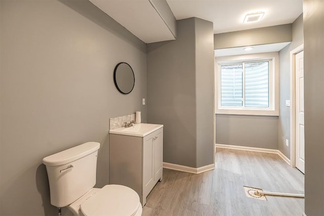 21720 Matthew Ln, Saegertown, PA 16433 - bathroom with toilet, wood finished floors, vanity, and baseboards