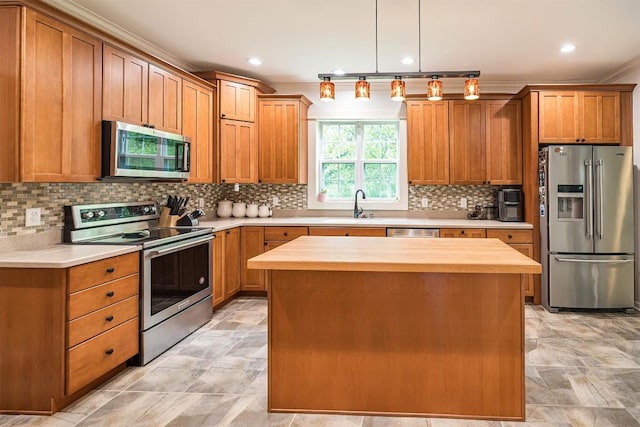 21720 Matthew Ln, Saegertown, PA 16433 - kitchen with appliances with stainless steel finishes, a sink, backsplash, butcher block countertops, and a center island
