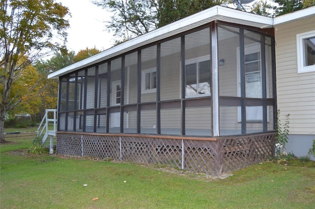 view of home's exterior featuring a lawn