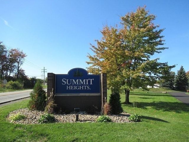 community sign with a lawn