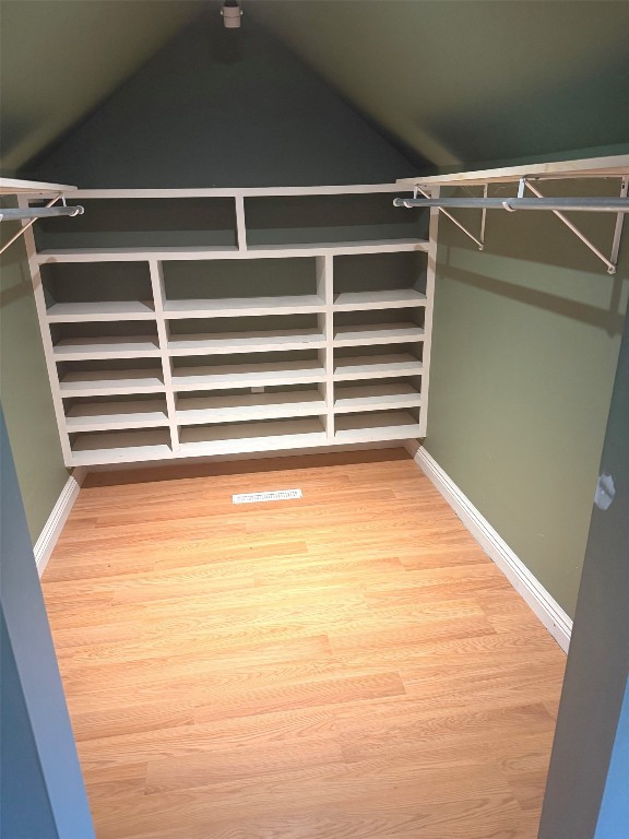 518 Spring St, Jamestown, PA 16134 - spacious closet featuring wood finished floors and vaulted ceiling
