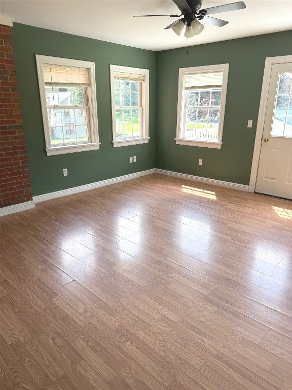518 Spring St, Jamestown, PA 16134 - unfurnished living room featuring ceiling fan and wood finished floors