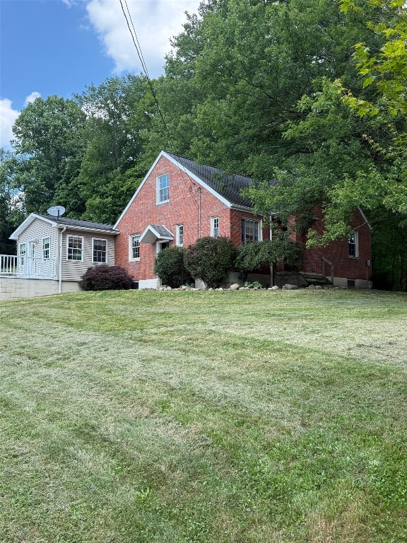 518 Spring St, Jamestown, PA 16134 - view of front of home featuring a front yard and brick siding