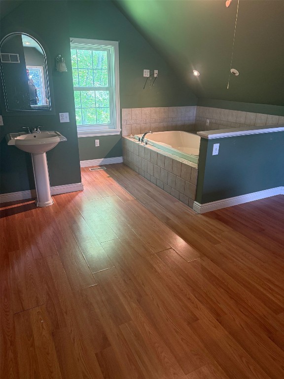 518 Spring St, Jamestown, PA 16134 - full bath featuring vaulted ceiling, wood finished floors, and a garden tub