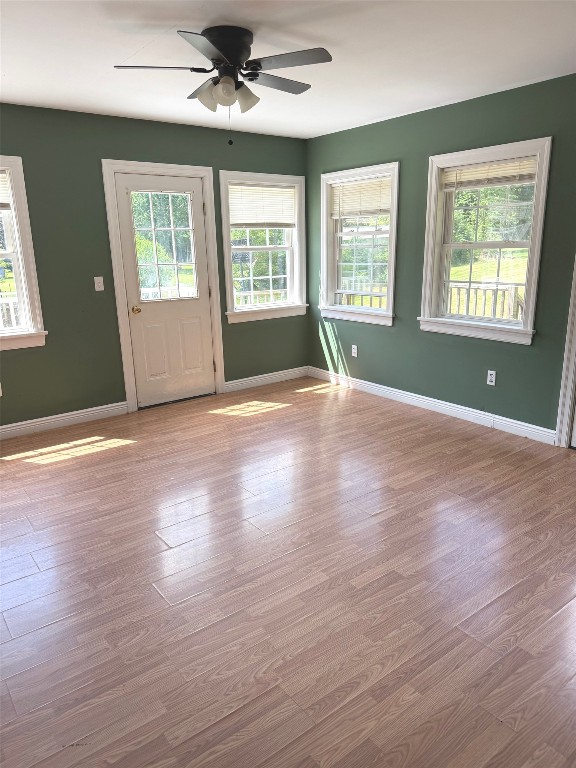 518 Spring St, Jamestown, PA 16134 - foyer entrance featuring healthy amount of natural light, a ceiling fan, and wood finished floors