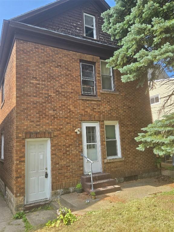 327 E 7th St, Erie, PA 16503 - back of property with entry steps and brick siding