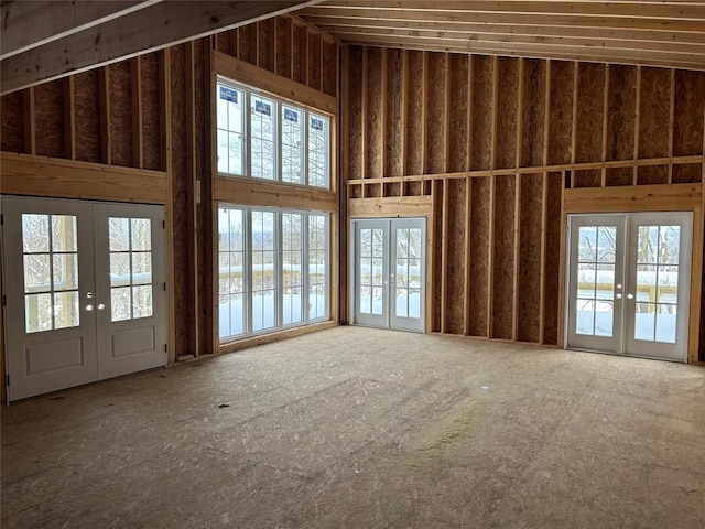 miscellaneous room featuring french doors and a high ceiling