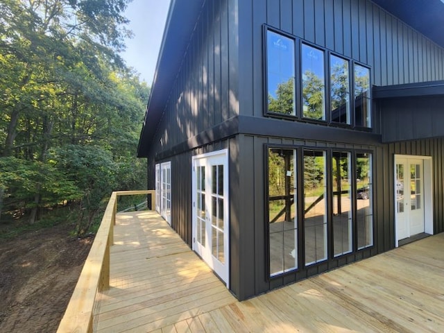 view of home's exterior featuring french doors and a wooden deck