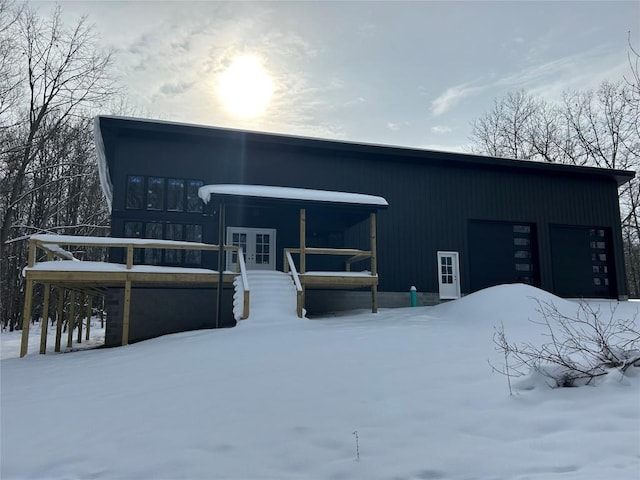 view of front of home with french doors and a garage