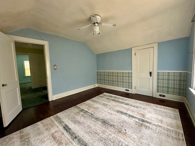 957 E 29th St, Erie, PA 16504 - unfurnished room with vaulted ceiling, a ceiling fan, dark wood-style flooring, and a wainscoted wall