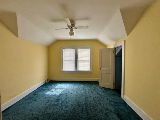 957 E 29th St, Erie, PA 16504 - additional living space featuring dark colored carpet, vaulted ceiling, and ceiling fan
