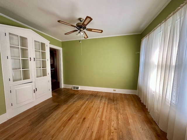 957 E 29th St, Erie, PA 16504 - spare room featuring ceiling fan, wood finished floors, and ornamental molding