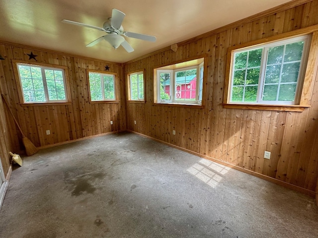 957 E 29th St, Erie, PA 16504 - carpeted spare room with ceiling fan and wood walls