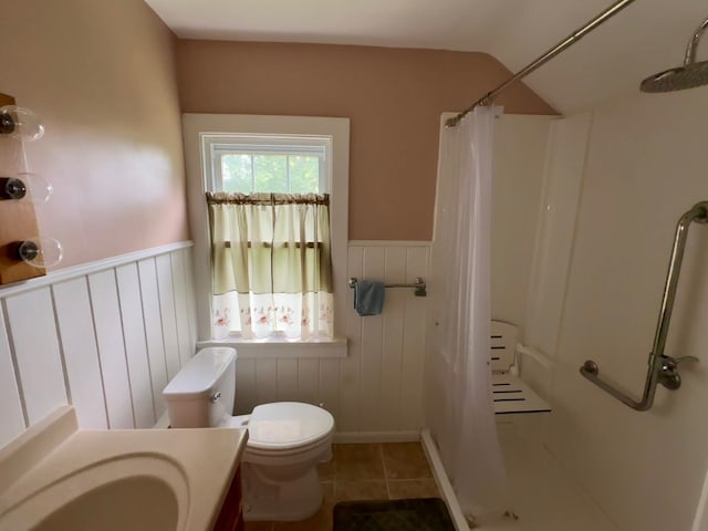 957 E 29th St, Erie, PA 16504 - bathroom featuring a shower with curtain, vanity, a wainscoted wall, and tile patterned flooring