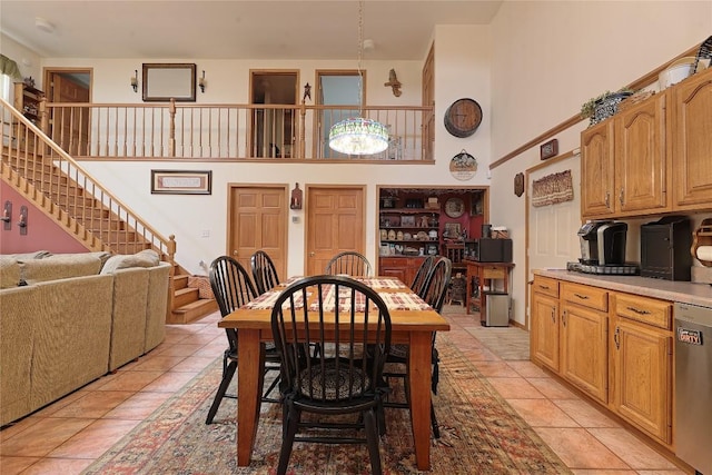 38753 Centerville Rd, Centerville, PA 16404 - dining area with a high ceiling, stairway, and light tile patterned floors