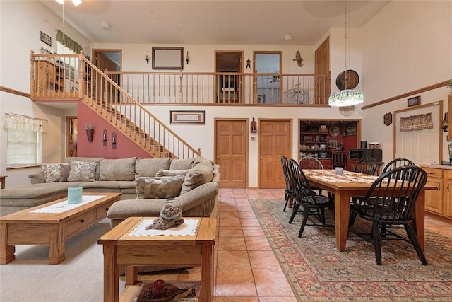 38753 Centerville Rd, Centerville, PA 16404 - living area with a towering ceiling, light tile patterned floors, and stairs