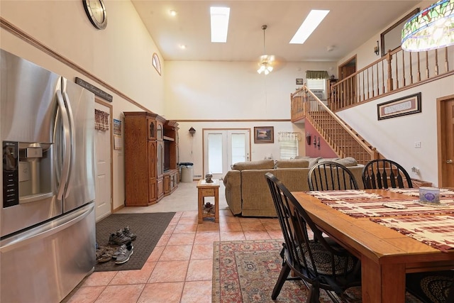 38753 Centerville Rd, Centerville, PA 16404 - dining room with a towering ceiling, a skylight, light tile patterned flooring, and stairway