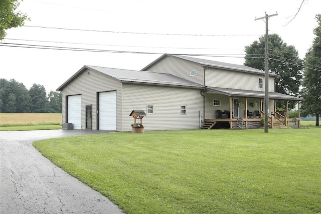 38753 Centerville Rd, Centerville, PA 16404 - rear view of house featuring covered porch and a yard
