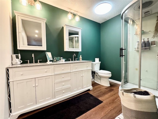 112 Willadell Rd, Pa, PA 16154 - full bath featuring double vanity, a shower stall, a textured ceiling, and wood finished floors