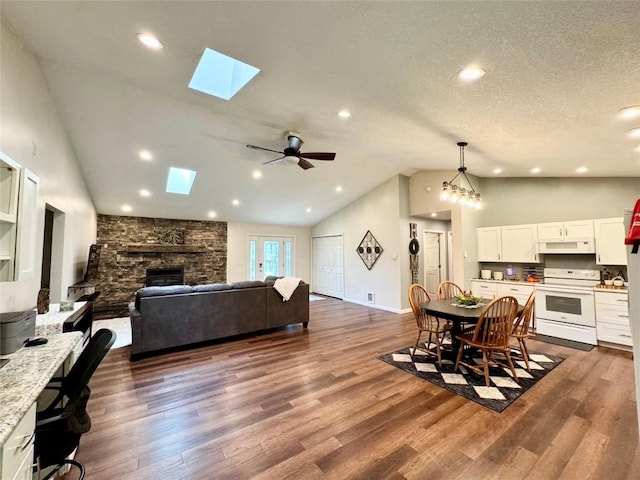 112 Willadell Rd, Pa, PA 16154 - dining space with a skylight, lofted ceiling, dark wood-type flooring, a fireplace, and recessed lighting