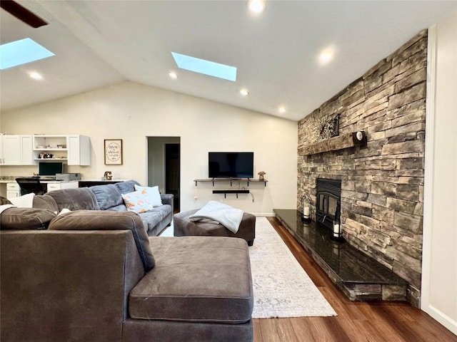 112 Willadell Rd, Pa, PA 16154 - living area featuring a skylight, vaulted ceiling, dark wood-style flooring, a stone fireplace, and recessed lighting