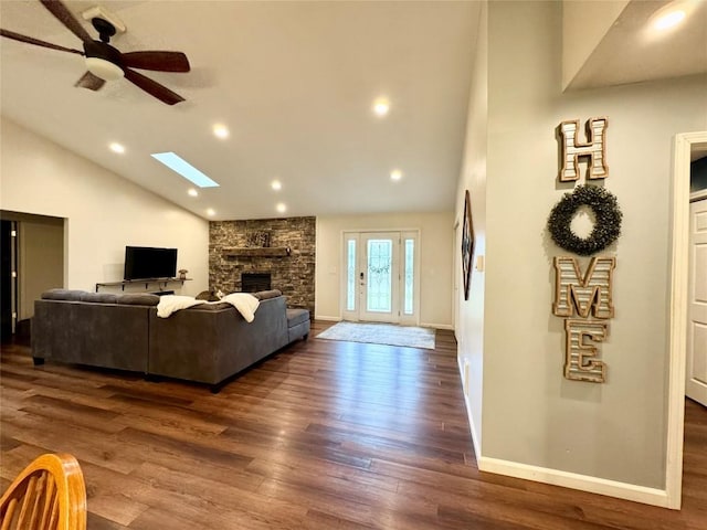 112 Willadell Rd, Pa, PA 16154 - living room with vaulted ceiling, a skylight, dark wood-style flooring, a stone fireplace, and ceiling fan