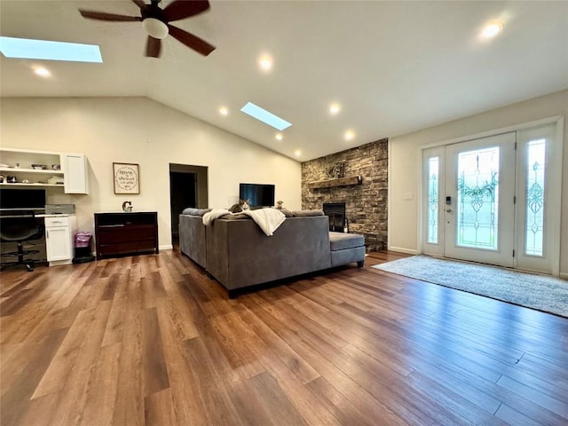 112 Willadell Rd, Pa, PA 16154 - living area featuring a skylight, ceiling fan, lofted ceiling, dark wood finished floors, and a fireplace