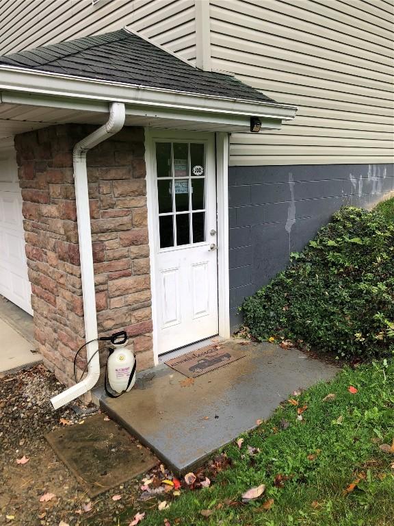 view of exterior entry featuring a garage